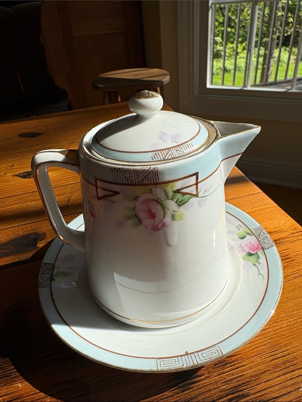 Porcelain Floral Creamer and Saucer in Pink with Gold Trim